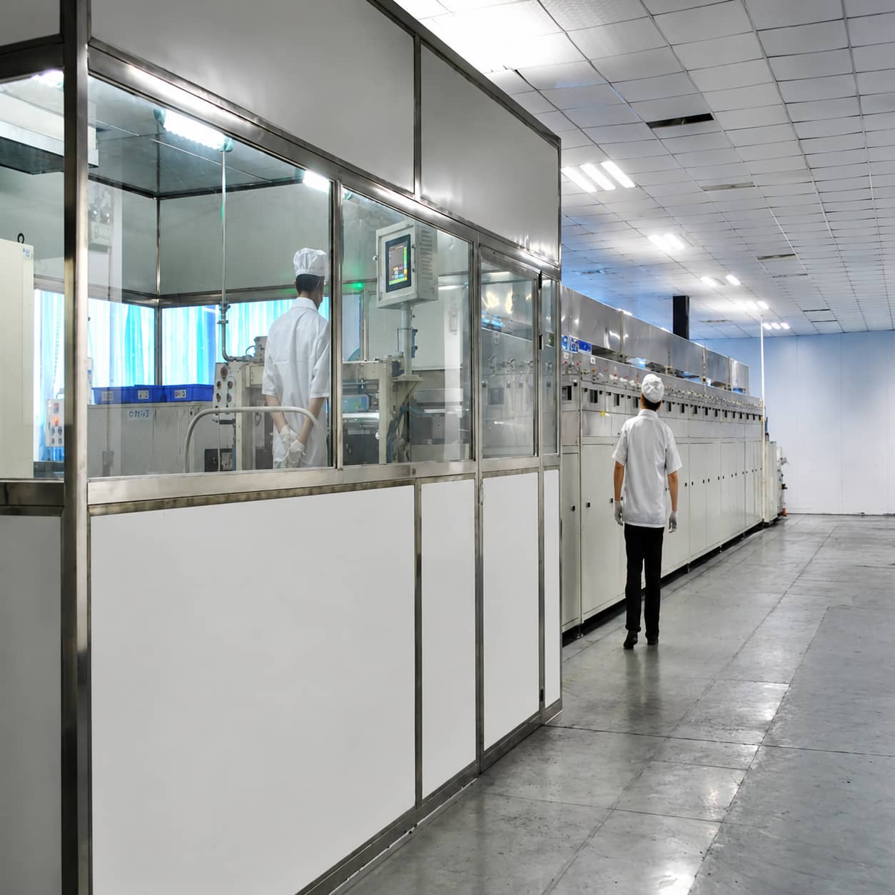 Lithium-ion battery electrode coating and drying process showing slurry coating on aluminum and copper current collectors using an integrated coating machine with segmented drying ovens.